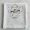 Blue teapot tea towel folded for storage