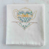 Yellow teapot tea towel folded for storage