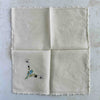 Back of unfolded cocktail napkin