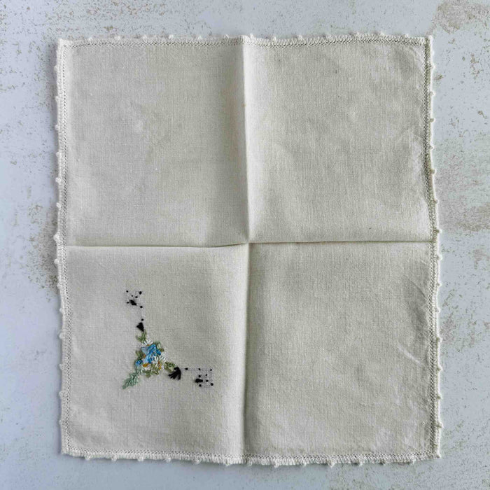 Back of unfolded cocktail napkin