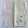 Front of unfolded cocktail napkin