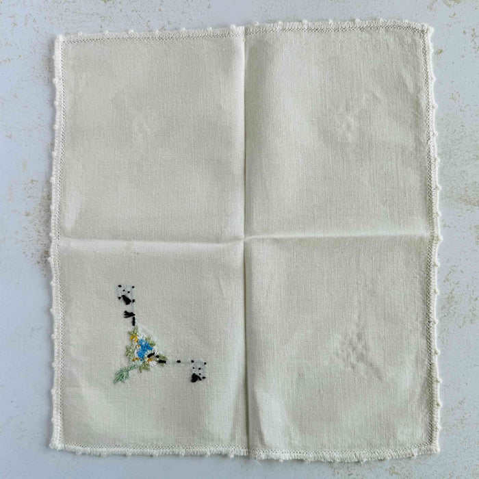 Back of unfolded cocktail napkin