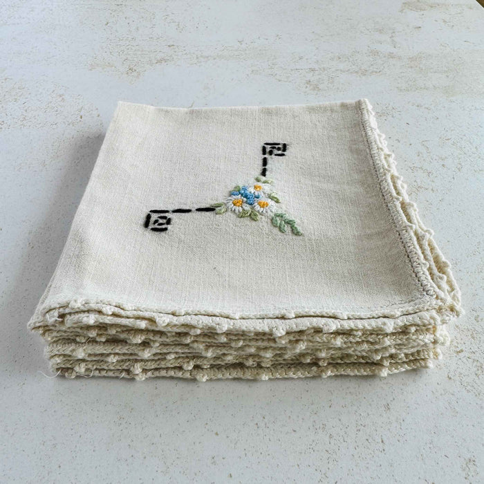 Folded stack of vintage Art Deco hand-embroidered cocktail napkins