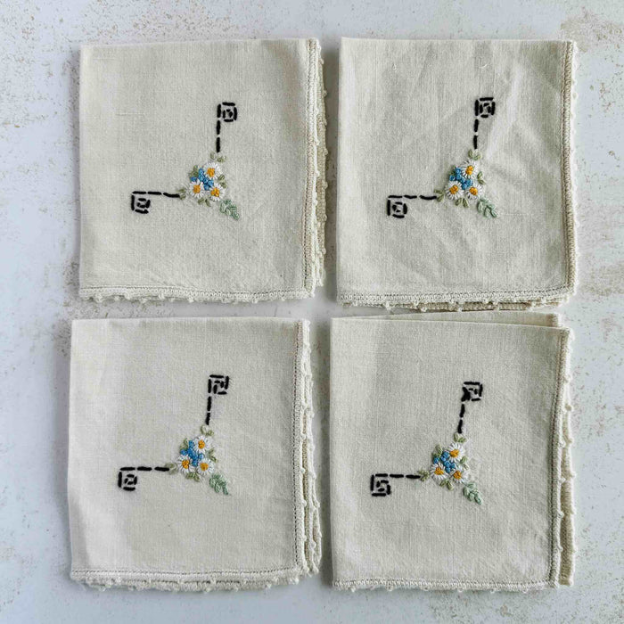 Fronts of folded cocktail napkins aranged in a grid