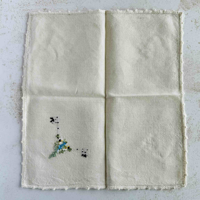 Back of unfolded cocktail napkin