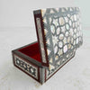 Three-quarter view of Inlaid wood box with lid raised showing mother of pearl inlay