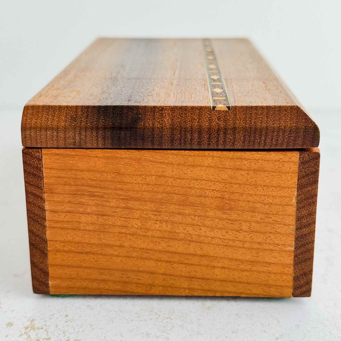 End side view of inlaid wood box