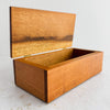 Three-quarter view of inlaid wood box with lid open