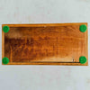 Underside of inlaid wood box showing green felt pads