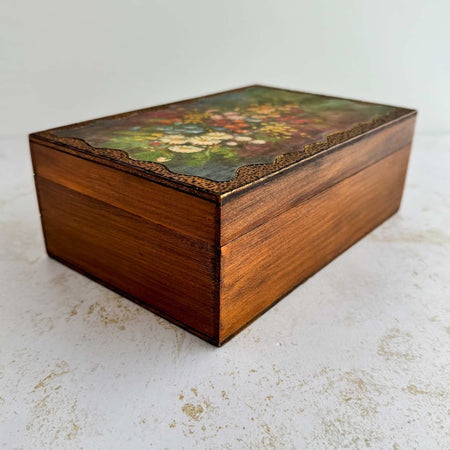 Three-quarter view of vintage floral wood keepsake box
