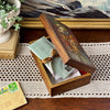 Vintage floral painted wood box styled open with letters and keepsakes showing decorative lid and storage space
