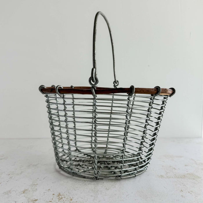 Three-quarter view of wire and twig basket