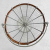 Top down view of top rim, handle, and inside of wire and twig basket