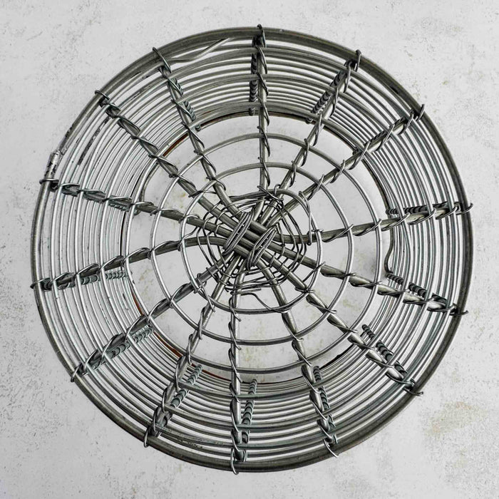 Underside of wire and twig basket showing wired construction