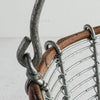 Close-up of handle and twig rim connection on wire and twig basket