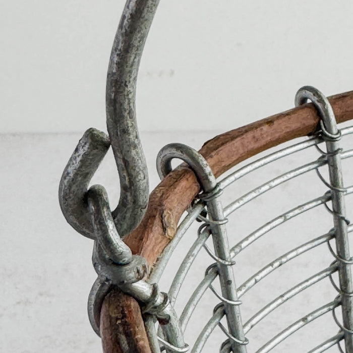 Close-up of handle and twig rim connection on wire and twig basket