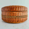 Side profile of basket with lid against a light background