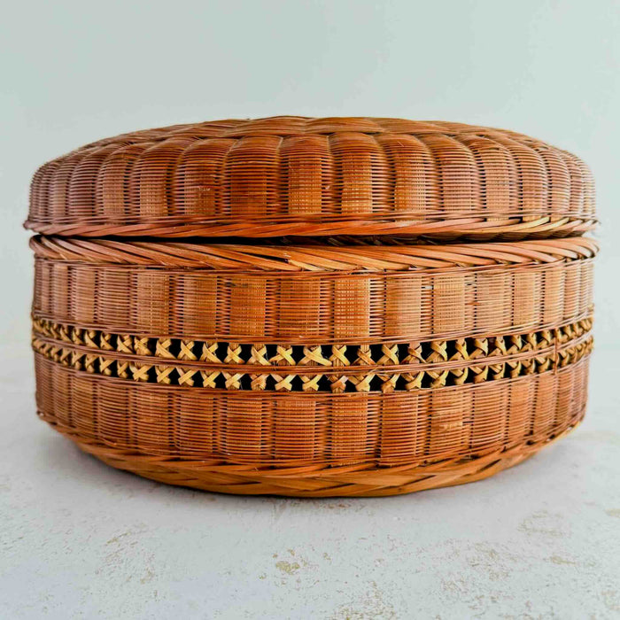 Side profile of basket with lid against a light background