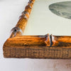 Close-up of bamboo frame corner on print of Chinese painting
