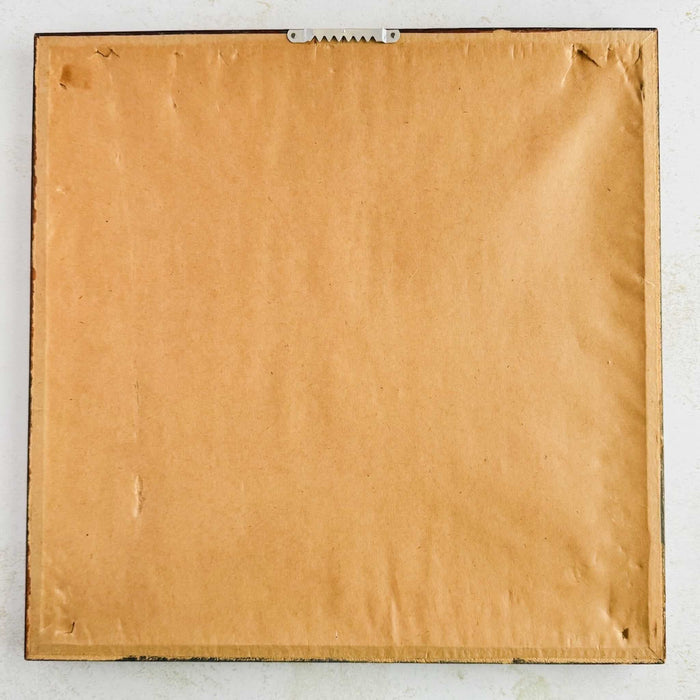 Back of bamboo framed print of Chinese painting showing brown paper and sawtooth hanger