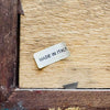 Close-up of Made In Italy label on back of Italian winter scene