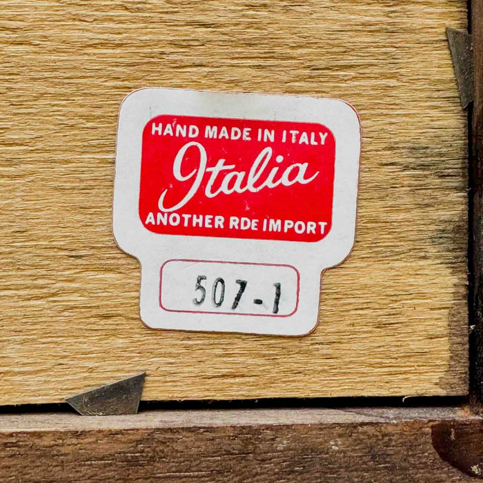 Close-up of numbered "Italia" label on back of Italian winter scene
