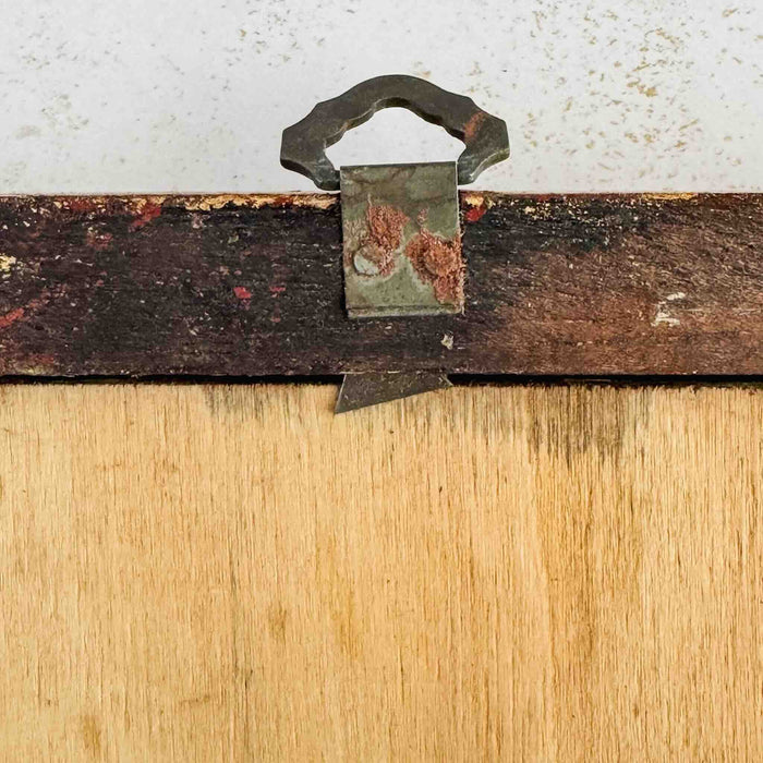Close-up of metal loop on back of framed floral still-life print