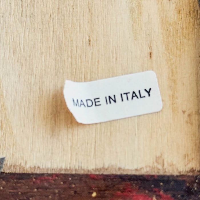 Close-up of Made in Italy label on back of floral still-life scene