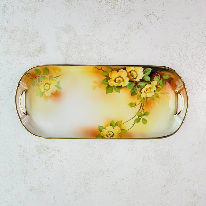 Full view of antique yellow rose tray showing hand-painted yellow roses, gold trim, and handles