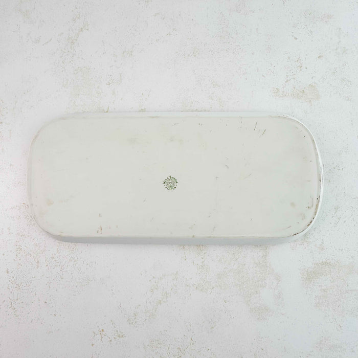 Back side of antique yellow rose tray showing stamp