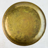 Back of the vintage brass tray showing the unmarked underside with natural age-related patina
