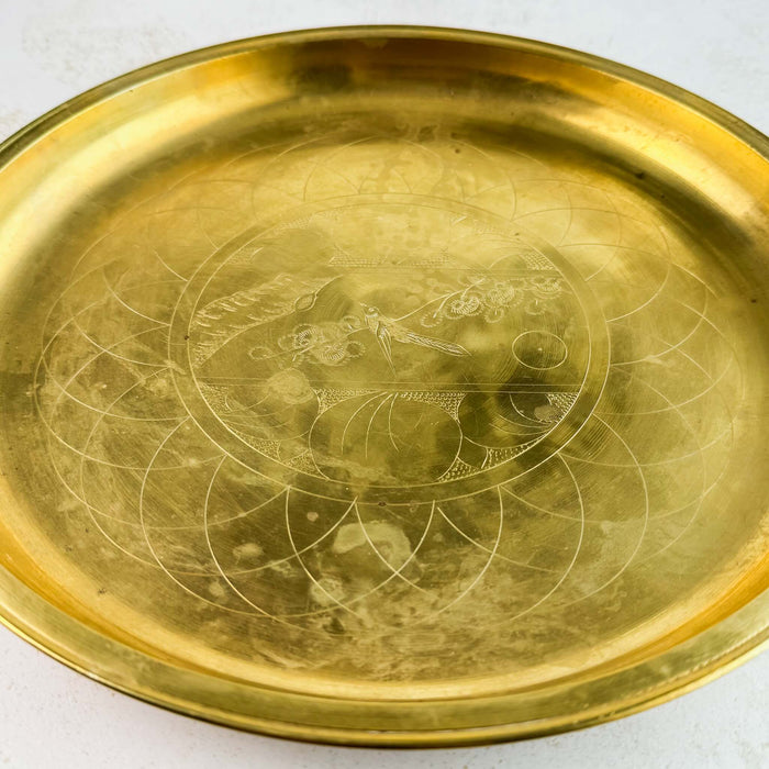 Slightly zoomed in view of vintage engraved brass tray