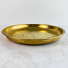 Three-quarter view of vintage engraved brass tray