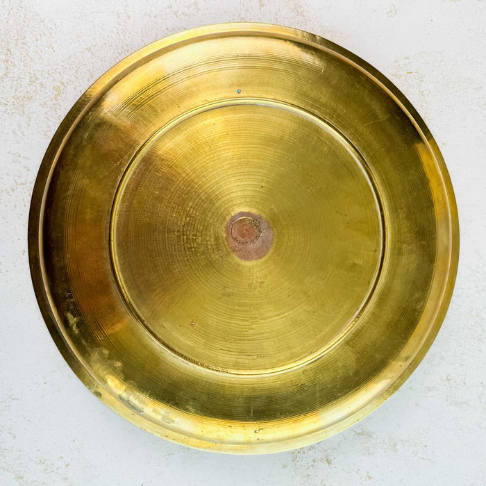 Back view of vintage engraved brass tray showing maker's mark