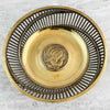 Full view of brass bowl with pierced sides and exotic bird center medalion