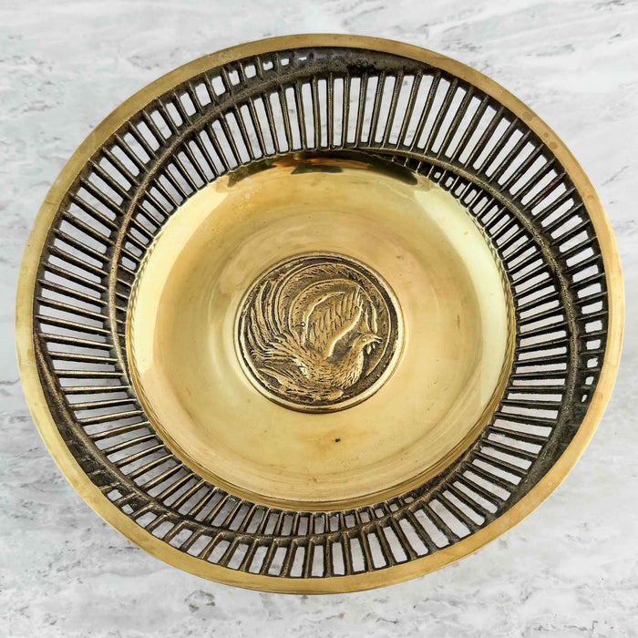Full view of brass bowl with pierced sides and exotic bird center medalion
