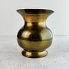 View of vintage brass pitcher with spout facing forwards