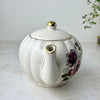 Vintage Gibsons Staffordshire England floral teapot, spout view showing the gold-trimmed spout and lid.