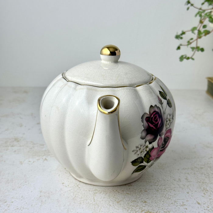 Vintage Gibsons Staffordshire England floral teapot, spout view showing the gold-trimmed spout and lid.