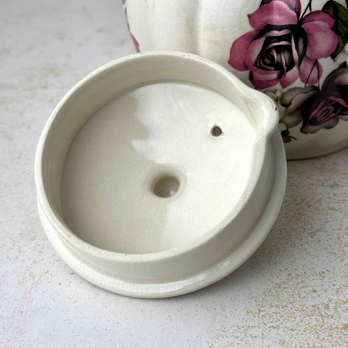 Vintage Gibsons Staffordshire England teapot lid, underside view showing the recessed fitting and steam vent.