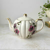 Vintage Gibsons Staffordshire England teapot with pink and black roses, fluted ivory body, and gold trim.