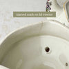 Close-up of the underside of the lid showing the same stained crack with 'stained crack on lid interior' text label