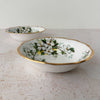 View of two Royal Albert White Dogwood dessert bowls with one in front of the other