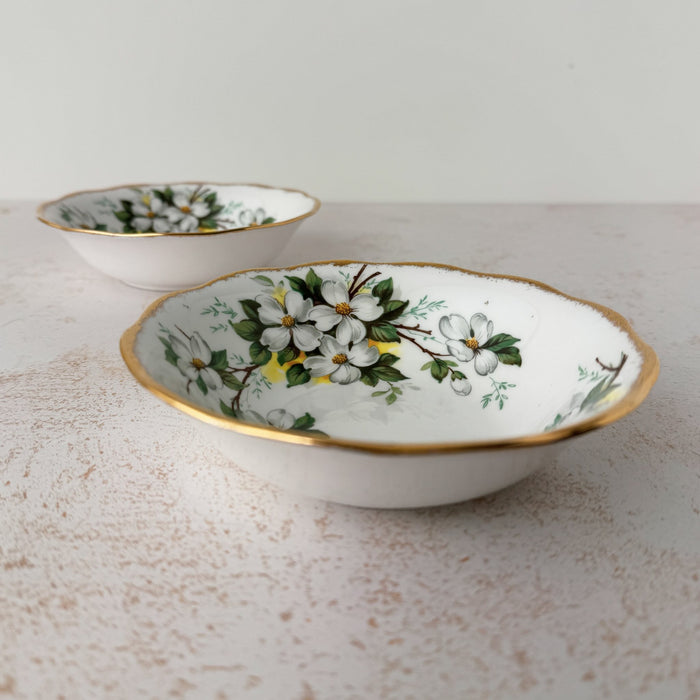 View of two Royal Albert White Dogwood dessert bowls with one in front of the other