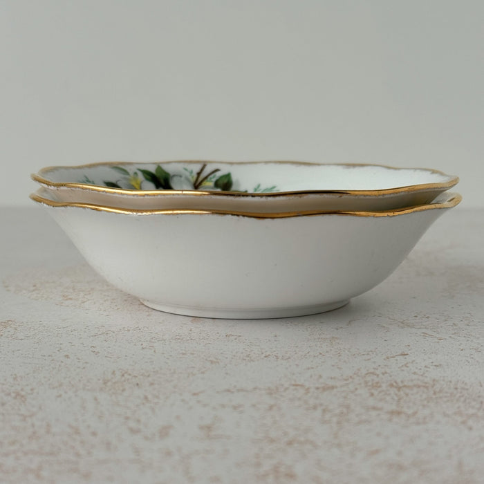 Side view of stacked Royal Albert White Dogwood dessert bowls