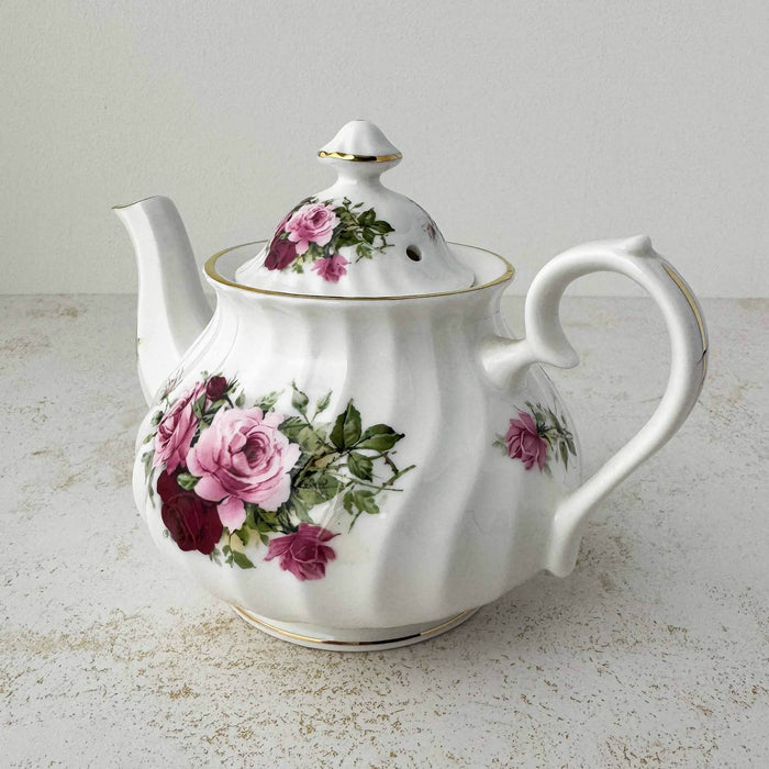 Three-quarter view of pink and burgundy rose Heirloom teapot