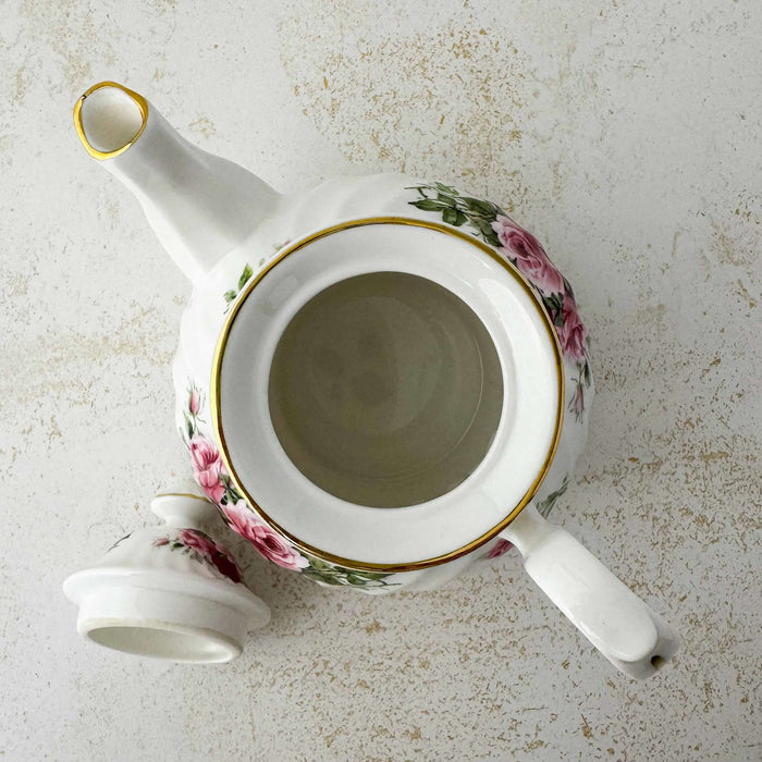 Top down view showing interior of pink and burgundy rose Heirloom teapot