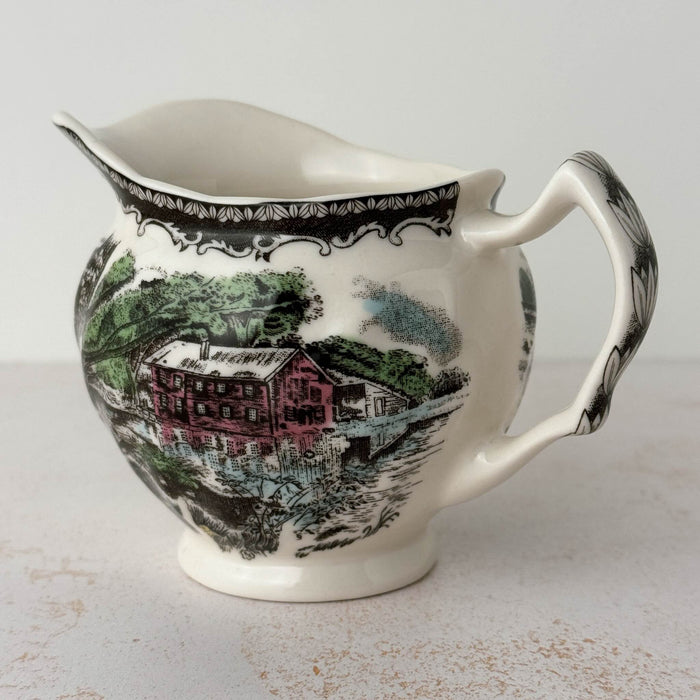 Three-quarter view of Johnson Bros Friendly Village creamer