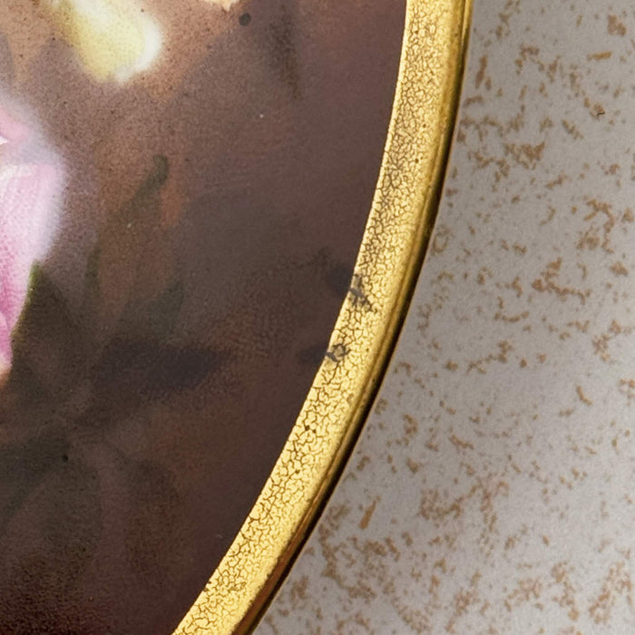 Close-up of irregular gold application to gold edge on Imperial Austria porcelain rose plate