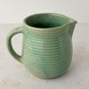 Opposite side view of green Monmouth ribbed stoneware creamer